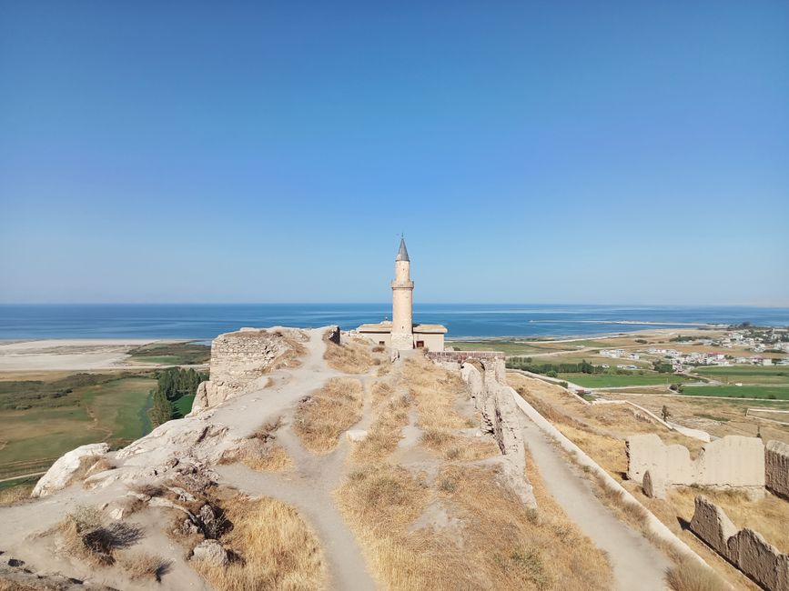 Stunning landscape of Van Castle overlooking Lake Van, Türkiye. Beautiful summer scenery.